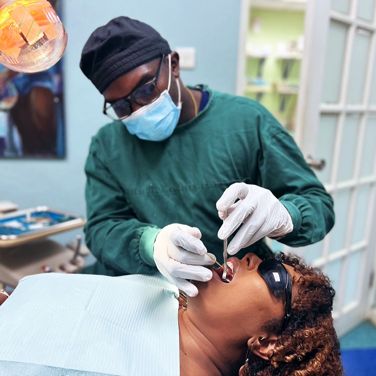 Dentist performing a teeth cleaning